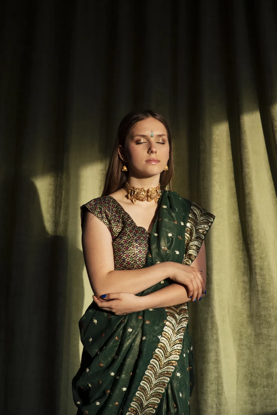 Emerald green saree with a hand-embroidered designer blouse