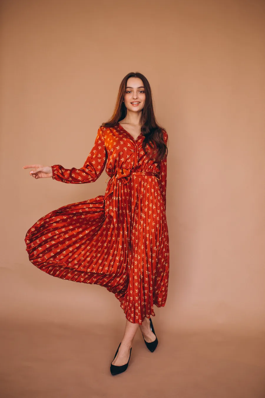 Rust red floral printed long kurti with a pleated skirt